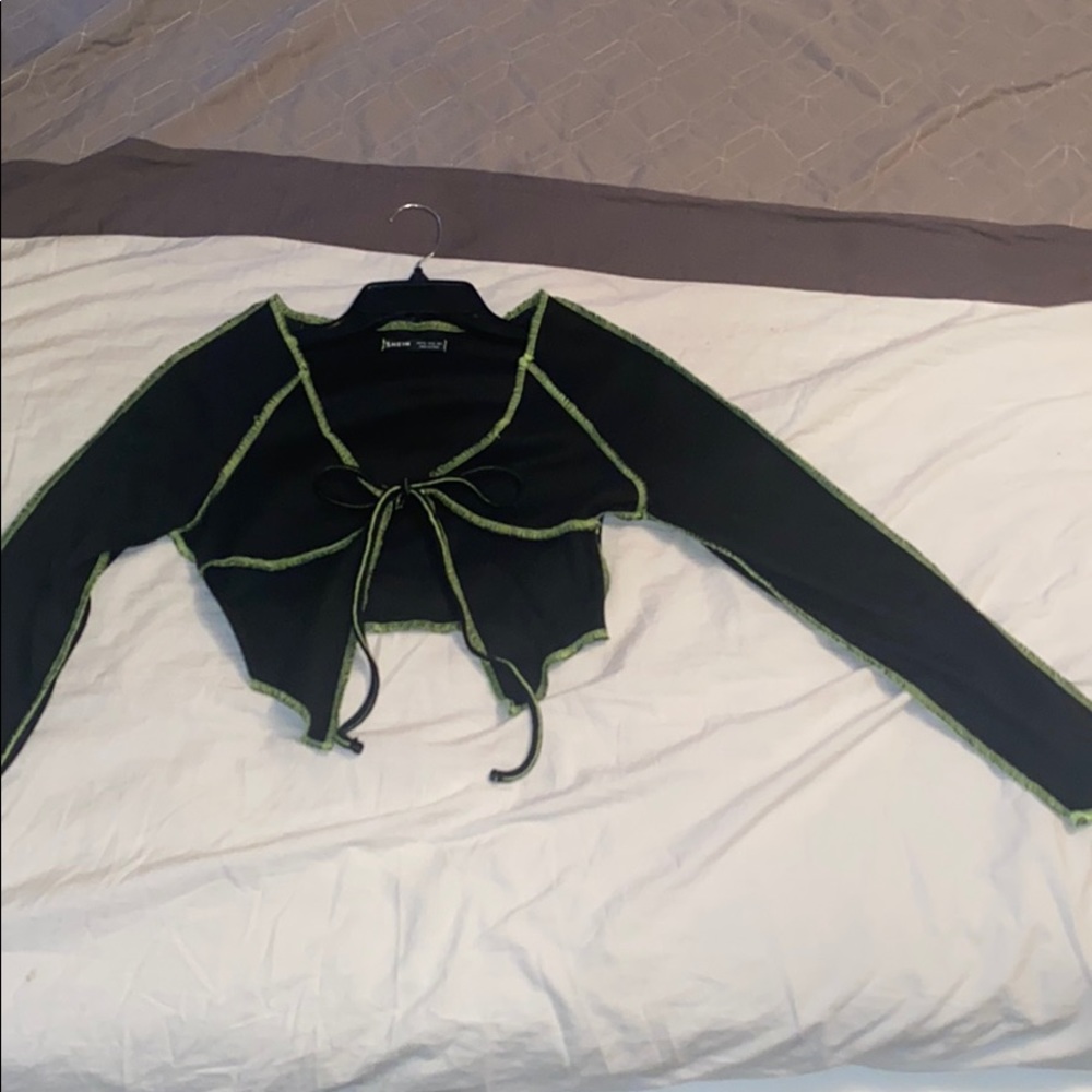 a lime green and black tied crop top